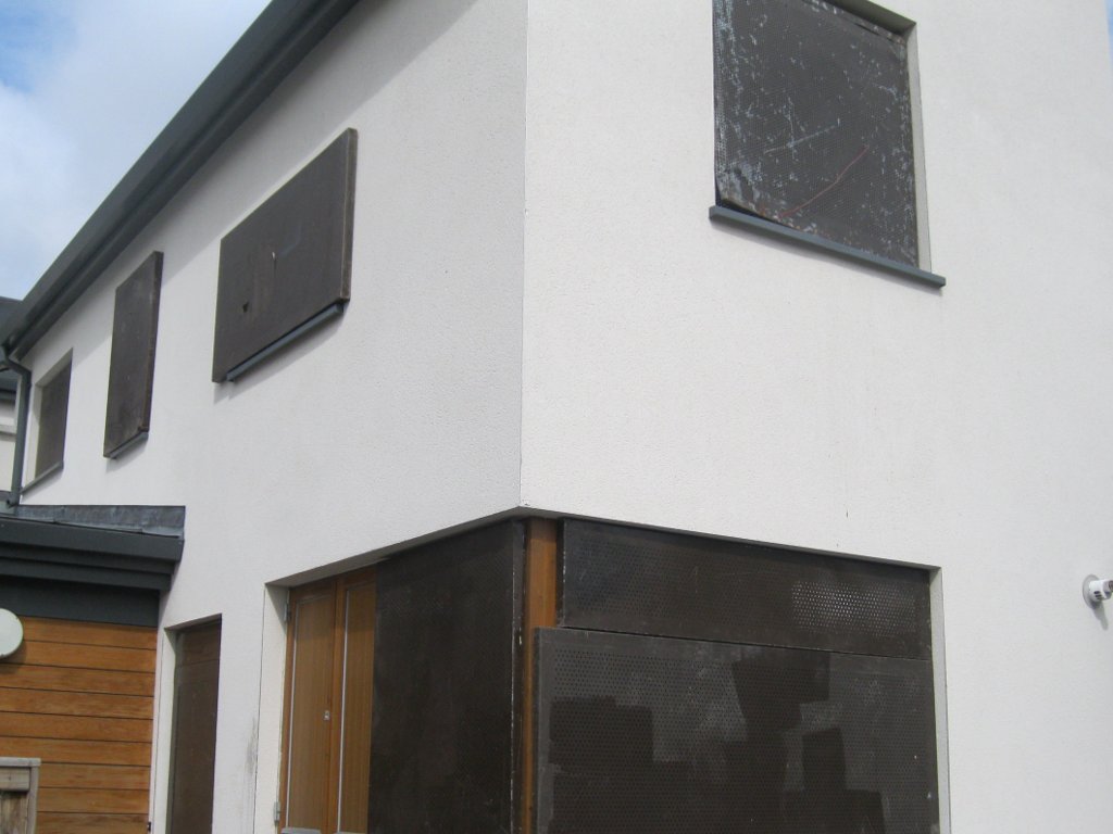Steel security screening installed on a building